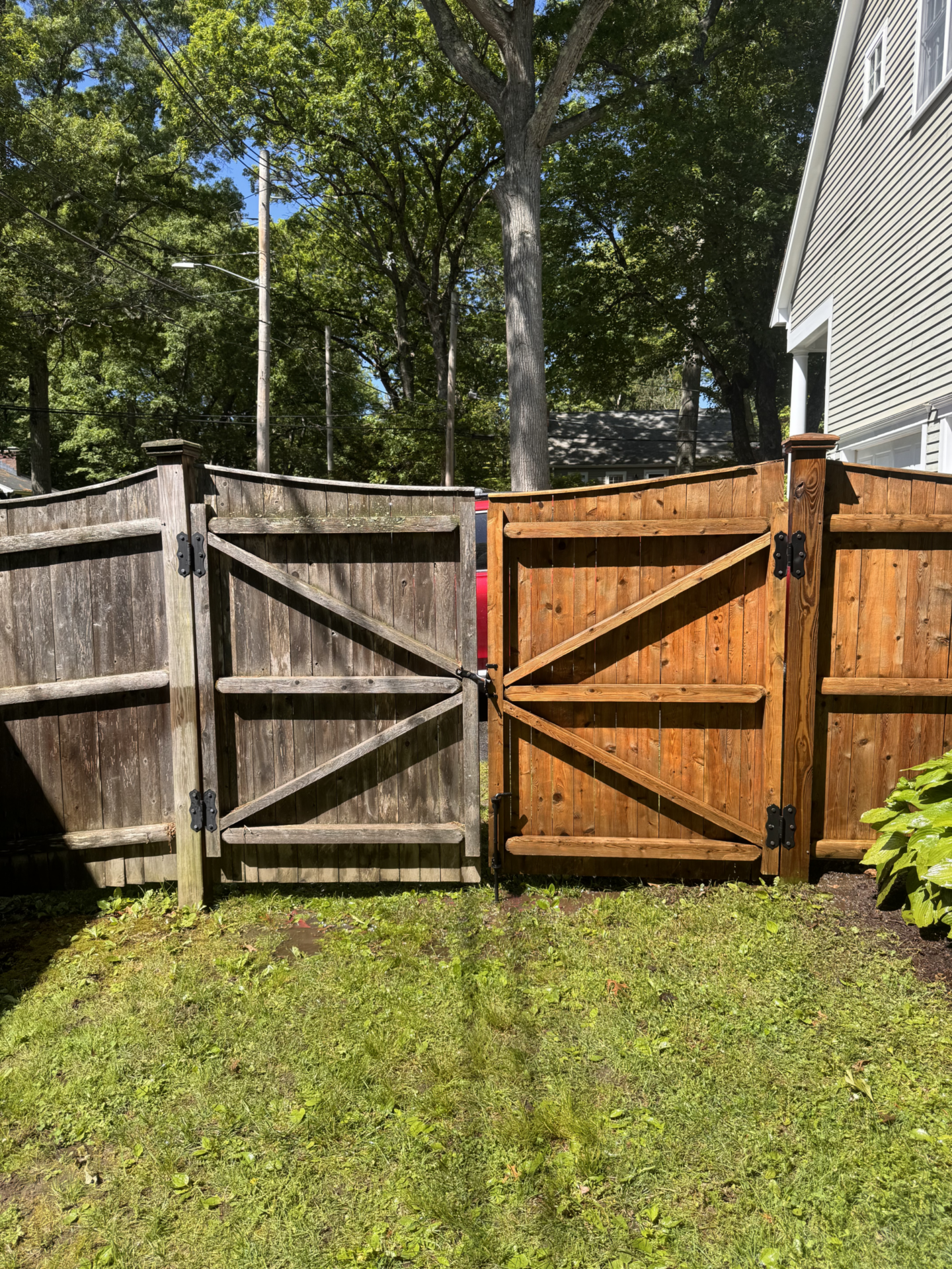 Pressure washing fence before and after treatment in Needham, MA
