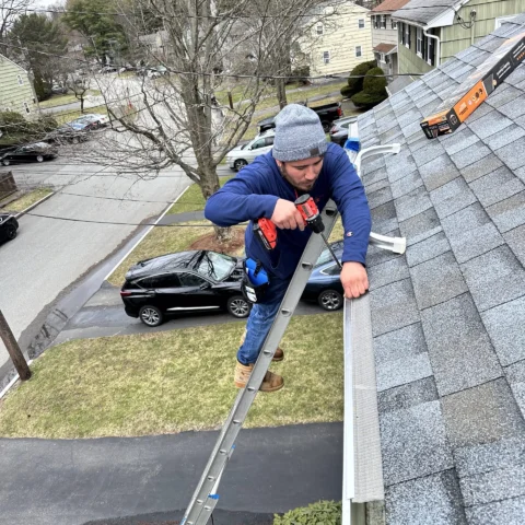 Windows Cleaning Expert professional installing gutter guards